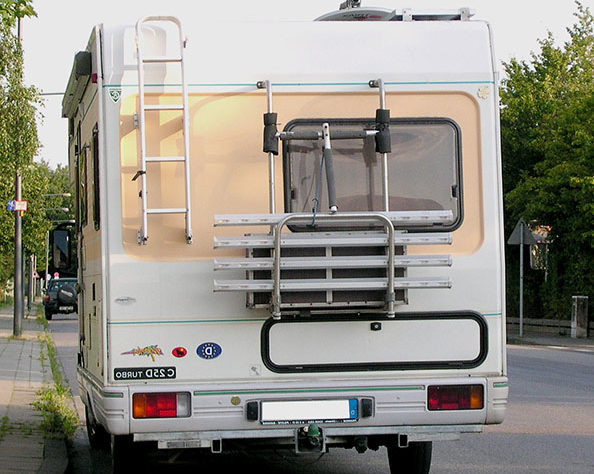 Recreational Vehicle Maintenance - RV parked at curb in a neighborhood