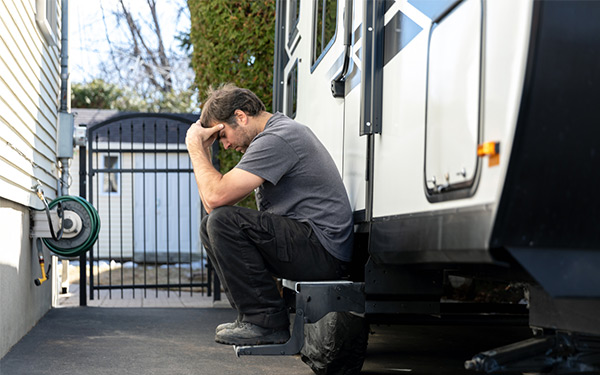 man upset next to RV