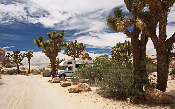 A parked RV in a desert landscape similar to Baja California