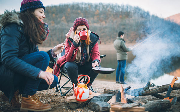campers preparing a winter camping meal