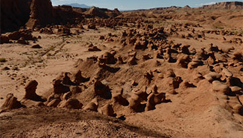 Image of Goblin Valley State Park, which is an otherworldly destination in Utah with strange Goblin like rock formations. 