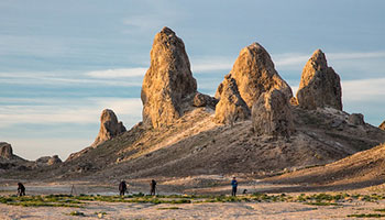 Image of the Trona Pinnacles, which is an otherworldly destination located in California. The pinnacles are large rock formations that are unlike any other. 