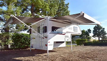 Image shows the lance 850 truck camper, which is an eco friendly camper made by Lance. 