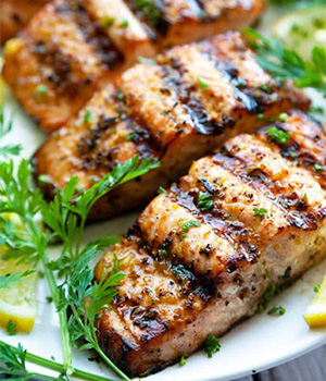 Grilled lemon pepper salmon served on a plate