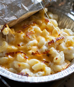 winter camping recipes: featured is mac and cheese in a aluminum tray 
