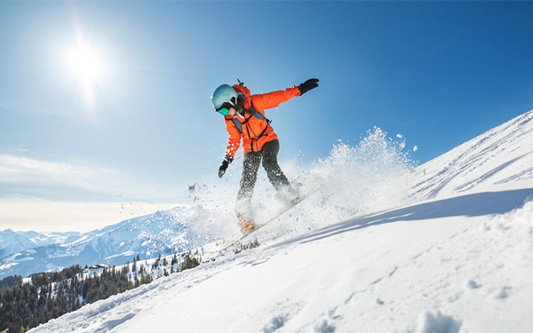 a person snowboarding down a slope