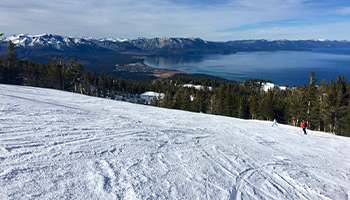 View of Lake Tahoe snow slopes, a popular snowboarding destination 