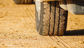 RV tire that is on a dirt road