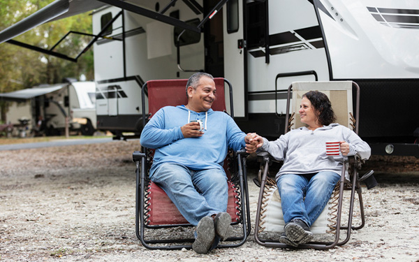 A couple relaxing at an RV campground in Florida