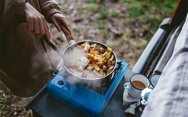 RVer boondock cooking on a portable grill