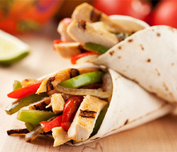 grilled chicken fajitas wrapped in a tortilla