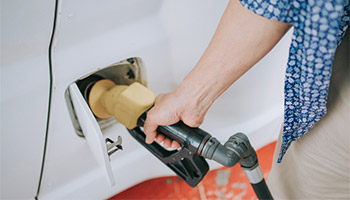 Filling up an RV gas tank before they store their RV