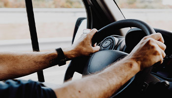 person driving an rv steering wheel