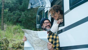 couple looking at map for nearby RV shows 