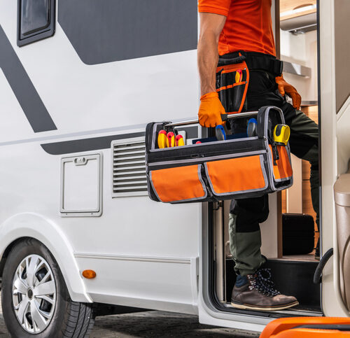 technician entering rv for rv repairs